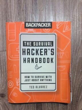 Backpacker The Survival Hacker's Handbook by Ted Alvarez - Orange Cover